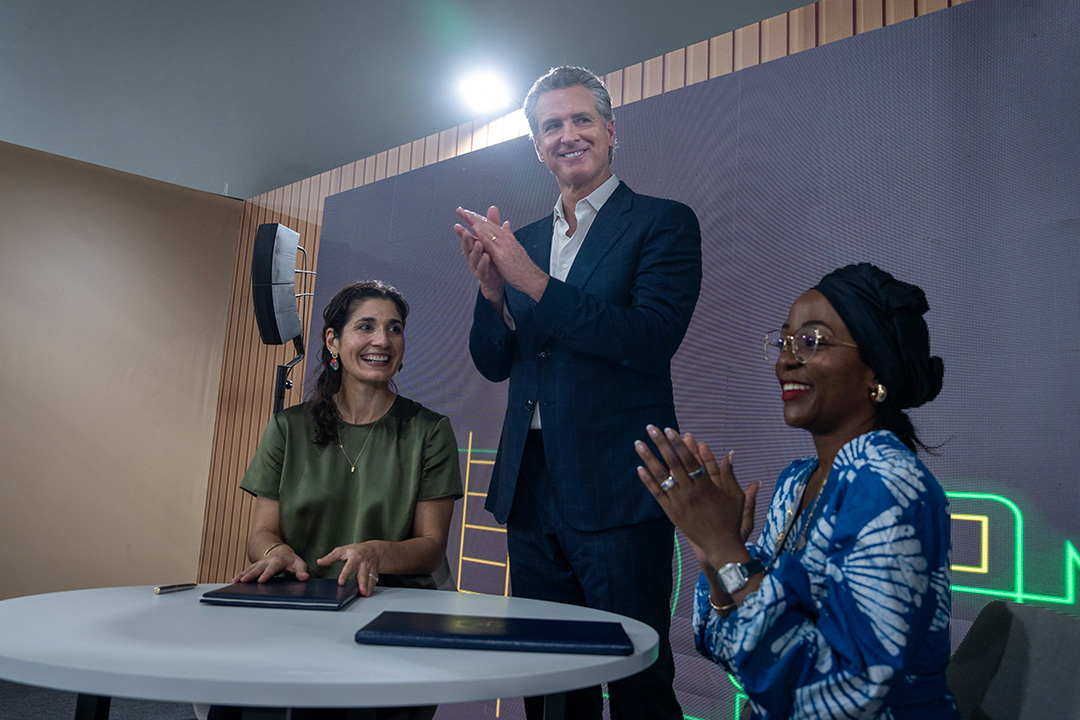 Image of people sitting at a table clapping